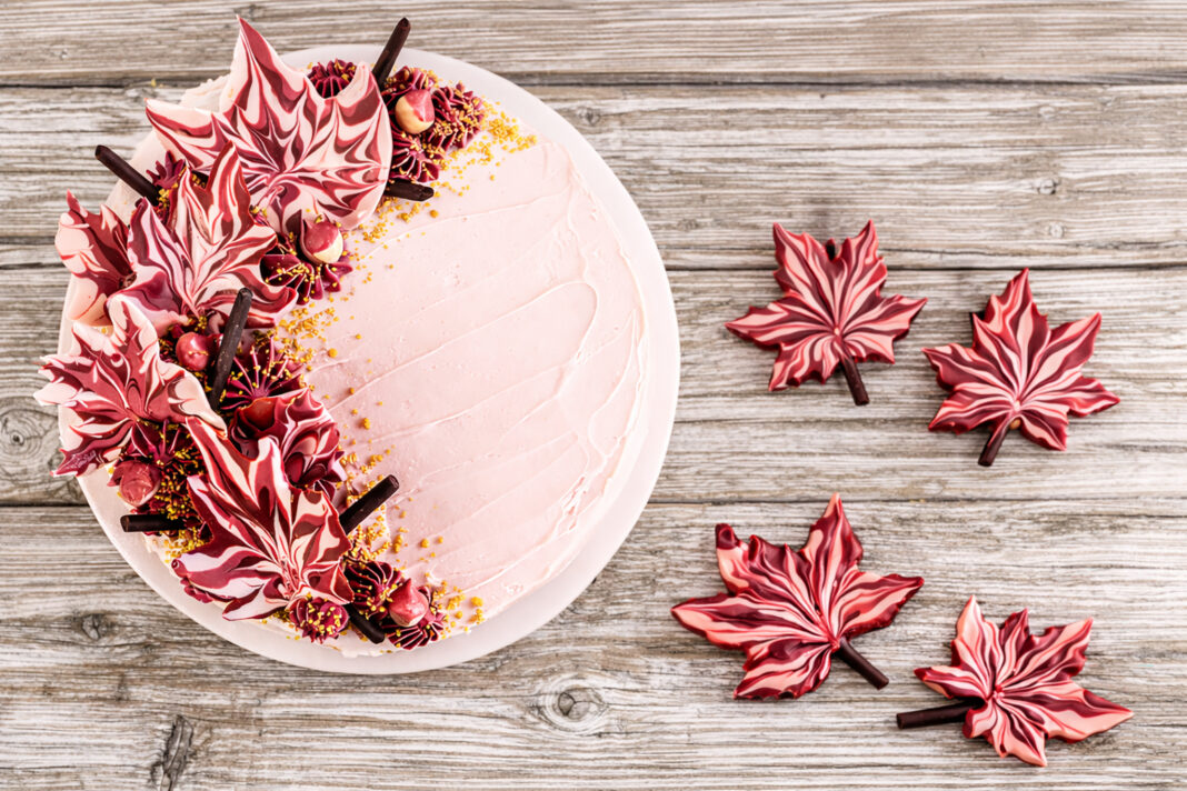 cake decorated with chocolate maple leaves